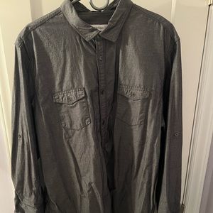 Gray long sleeve shirt with arm strap to roll up sleeves